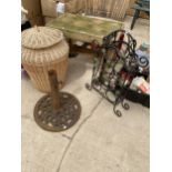 A COLLECTION OF ITEMS TO INCLUDE A CAST IRON PARASOL BASE, A METAL 9 BOTTLE WINE RACK AND A GARDEN