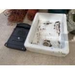 A WHITE BELFAST SINK AND A METAL LETTER BOX