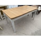 A MODERN PINE DINING TABLE