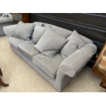 A PAIR OF MODERN GREY TWO SEATER SETTEES WITH TWELVE LOOSE CUSHIONS AND ANTIMACASSARS