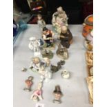 A QUANTITY OFCERAMIC FIGURINES TO INCLUDE A MONK, ANIMALS, CONTINENTAL STYLE, PIN CUSHION DOLLS, ETC
