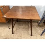 A LOW VICTORIAN MAHOGANY OCCASIONAL TABLE ON TURNED LEGS, 23.5" SQUARE