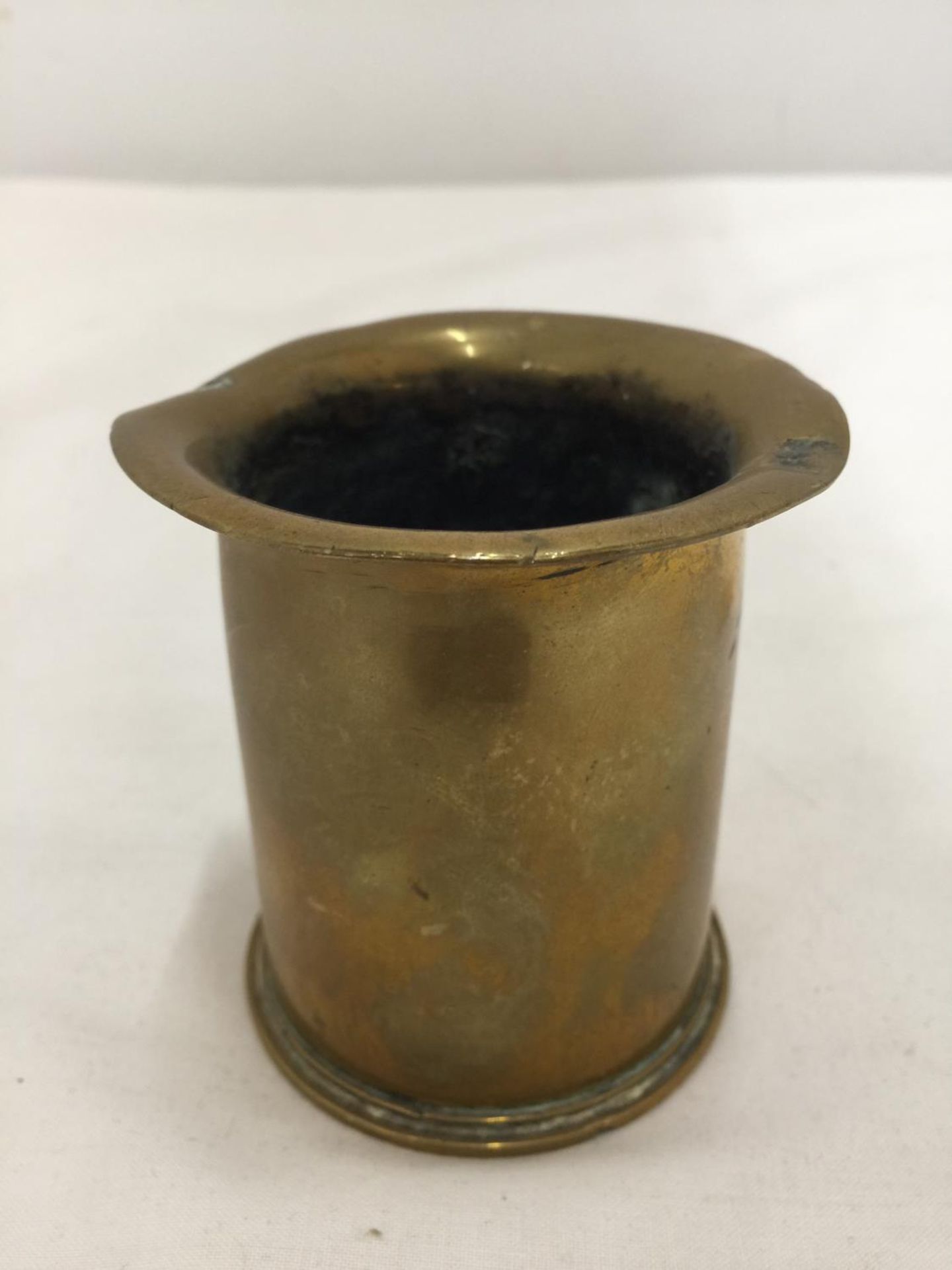 A SMALL BRASS TRENCH ART VASE HEIGHT 7.5CM