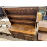 AN ANTIQUE STYLE OAK DRESSER ENCLOSING CUPBOARDS AND DRAWERS, COMPLETE WITH PLATE RACK, 48" WIDE