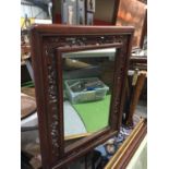 A MAHOGANY FRAMED MIRROR WITH PIERCED FRETWORK 41CM X 53CM