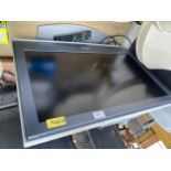 A SONY BRAVIA 26" TELEVISION WITH REMOTE CONTROL