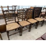 A SET OF FOUR LANCASHIRE STYLE LADDERBACK DINING CHAIRS WITH RUSH SEATS