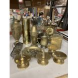 A LARGE QUANTITY OF BRASSWARE TO INCLUDE CANDLE STICKS AND CANDLE SNUFFERS, WOODEN AND BRASS BISCUIT
