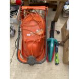 AN ELECTRIC FLYMO HOVER VAC, A BOSCH ELECTRIC HEDGE TRIMMER AND AN AXE