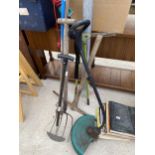 AN ASSORTMENT OF GARDEN TOOLS TO INCLUDE A PICK AXE, A FORK AND AN ELECTRIC GRASS STRIMMER ETC