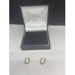 A PAIR OF 9 CARAT GOLD HOOP STYLE EARRINGS