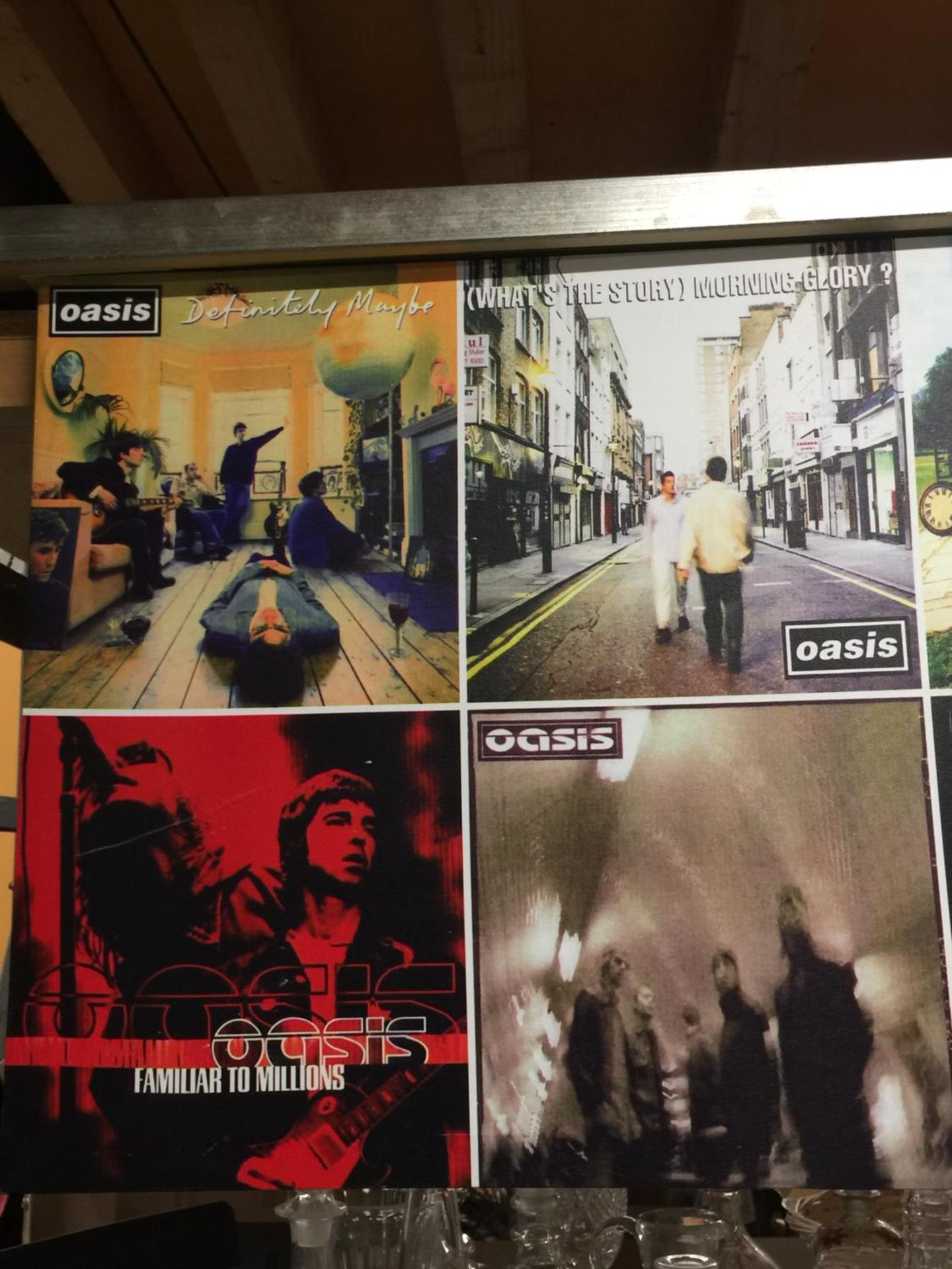 A LARGE CANVAS OF OASIS ALBUM COVERS - 122 X 51 CM - Image 2 of 3