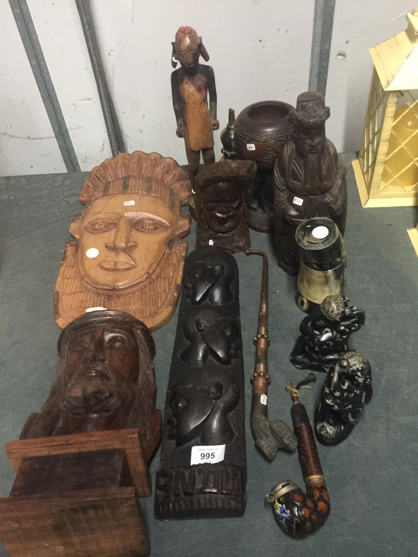 A COLLECTION OF TREEN ITEMS TO INCLUDE CARVED WALL PLAQUES, A TREEN BUST 'ELEPHANT' GOBLET, ELEPHANT