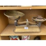 A PAIR OF VINTAGE KITCHEN SCALES WITH WEIGHTS