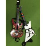 A 'GUITAR HERO' GUITAR AND AN X BOX GUITAR