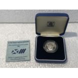 A ROYAL MINT 1986 XIII COMMONWEALTH GAMES SILVER COMMEMORATIVE £2 COIN WITH COA