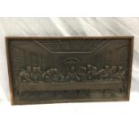 A HEAVY CAST IRON HANGING PLAQUE OF THE LAST SUPPER W: 67CM