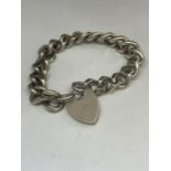 A GENTS HEAVY SILVER WRIST CHAIN WITH HEART SHAPED LOCKET CLASP