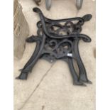 A PAIR OF DECORATIVE CAST IRON BENCH ENDS