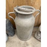 A SMALL GALVANISED MILK CHURN WITH LID STAMPED 'LCT'