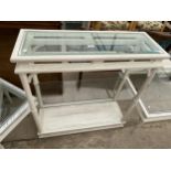 A MODERN LIMED THREE TIER SIDE DISPLAY TABLE WITH GLASS TOP AND ONE GLASS SHELF, 35.5" WIDE