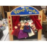 A WOODEN PUPPET THEATRE WITH PUPPETS