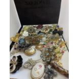 A BAG OF COSTUME JEWELLERY BROOCHES