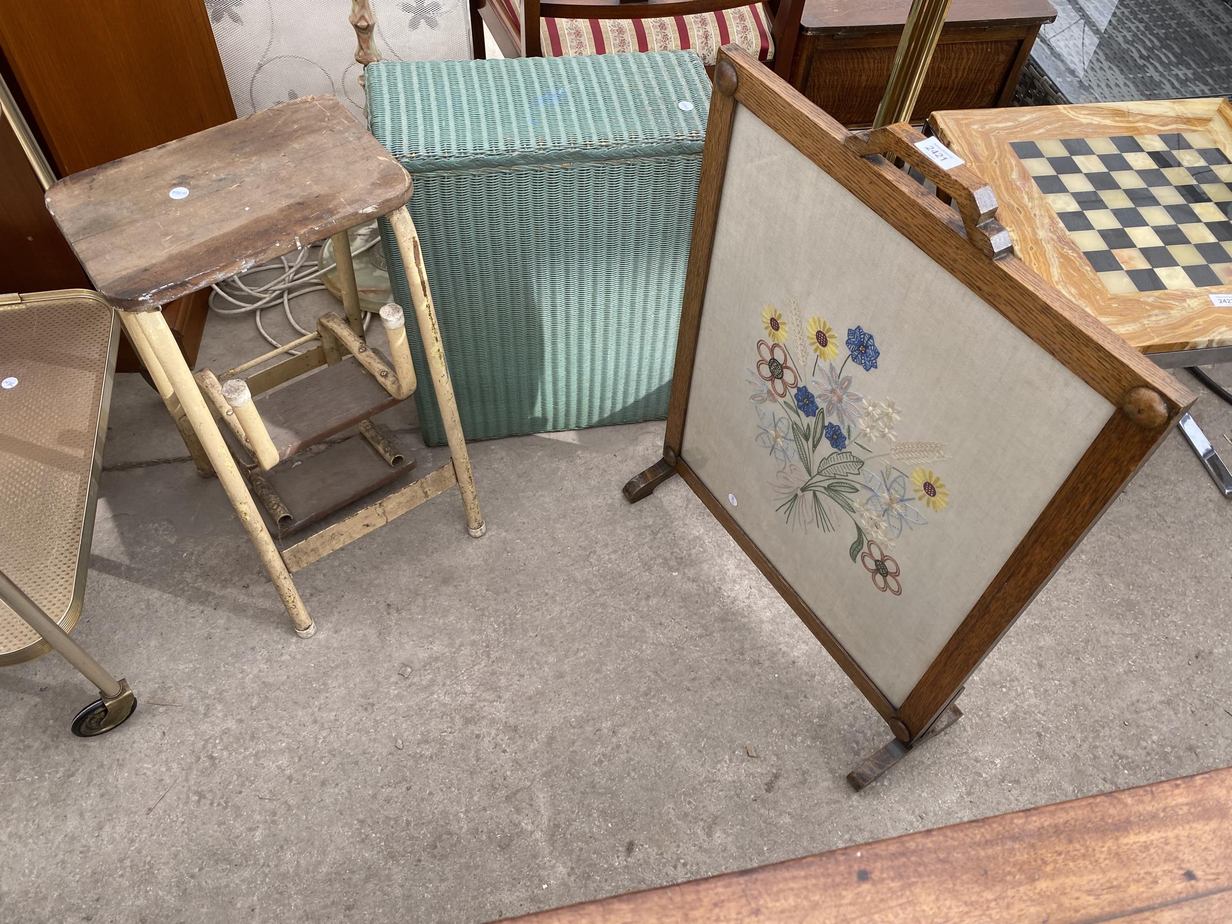 A LLOYD LOOM LINEN BASKET, NEEDLEWORK OAK FRAMED FIRESCREEN AND STEP STOOL