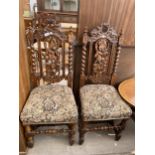 A PAIR OF EARLY 20TH CENTURY OAK JACOBEAN STYLE DINING CHAIRS WITH BARLEYTWIST UPRIGHTS AND TURNED