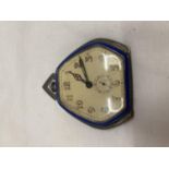 A VINTAGE ART DECO STYLE SILVER TRAVELLING CLOCK WITH HEXAGANOL FACE ANDE BLUE ENAMEL OUTER EDGE