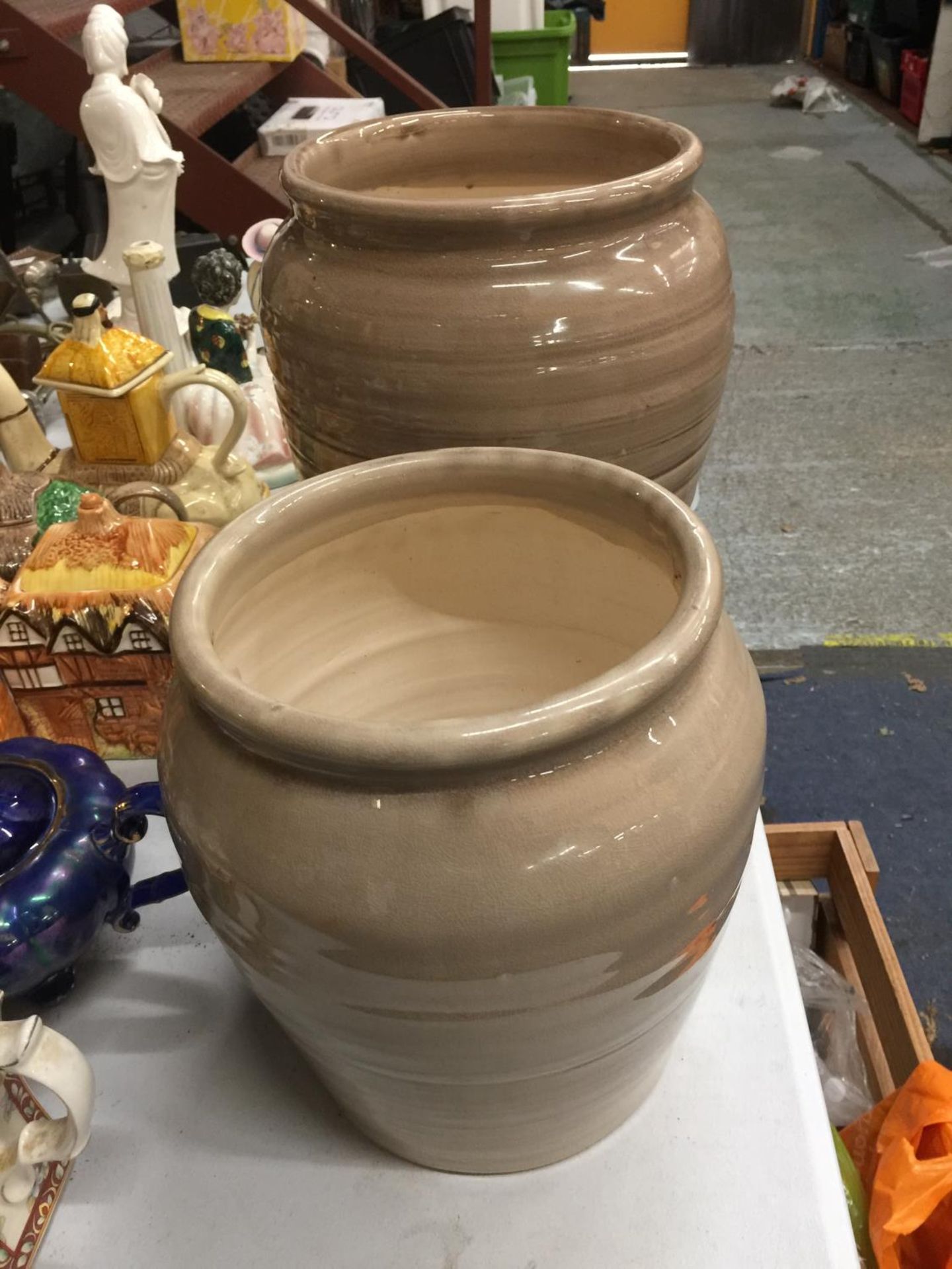 TWO LARGE STONEWARE PLANTERS/VASES IN A CAPPUCCINO COLOUR HEIGHT 31CM AND 24CM