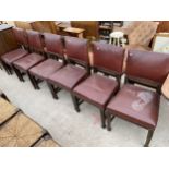 A SET OF SIX MID 20TH CENTURY OAK CHAIRS WITH STUDDED FAUX LEATHER SEATS AND BACKS