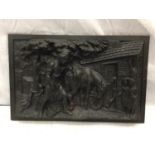 A HEAVY CAST IRON VICTORIAN PLAQUE DEPICTING A FARRIER AND A HORSE