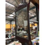 A GEORGIAN MAHOGANY FRAMED MIRROR WITH DECORATIVE TOP AND BOTTOM 64CM X 33.5CM