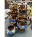 A QUANTITY OF JUGS IN A BRONZE AND BLUE COLOUR WITH FLORAL DECORATION