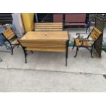 A REFURBISHED CAST IRON AND SOLID OAK SLATTED GARDEN PATIO SET COMPRISING OF A RECTANGULAR TABLE,