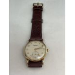 A GENTS VINTAGE 9 CARAT GOLD WRIST WATCH - WORKING AT TIME OF CATALOGING BUT NO WARRANTY GIVEN