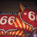 A PAIR OF 'ROUTE 66' CUSHIONS
