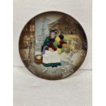 A ROYAL DOULTON 25 CM PLATE "THE OLD BALLOON SELLER"