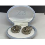A PAIR OF SILVER CLIP BROOCHES IN A PRESENTATION BOX