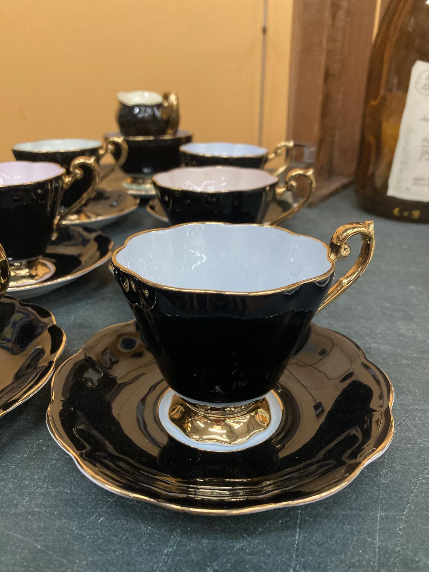 A VINTAGE ROYAL STANDARD 'HARLEQUIN' TEASET - BLACK WITH DIFFERENT COLOURED INTERIORS- TO INCLUDE - Image 2 of 4