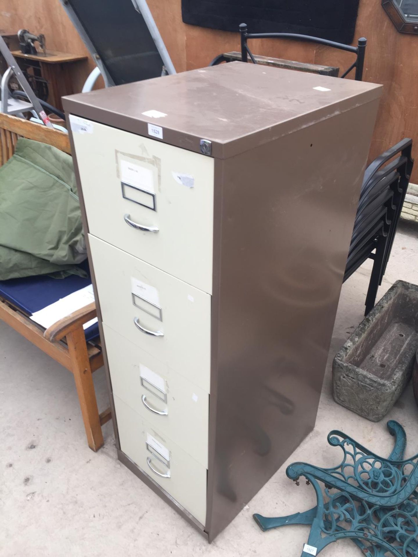 A FOUR DRAWER METAL FILING CABINET