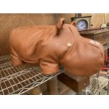 A FAUX LEATHER HIPPO DOORSTOP/STOOL