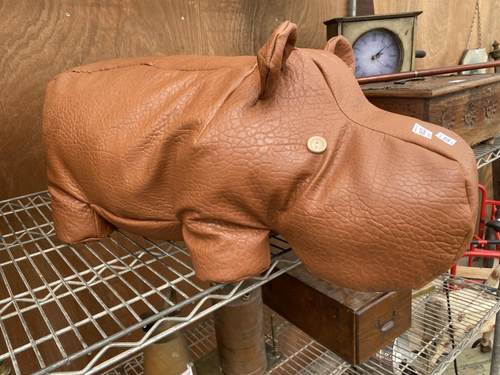 A FAUX LEATHER HIPPO DOORSTOP/STOOL