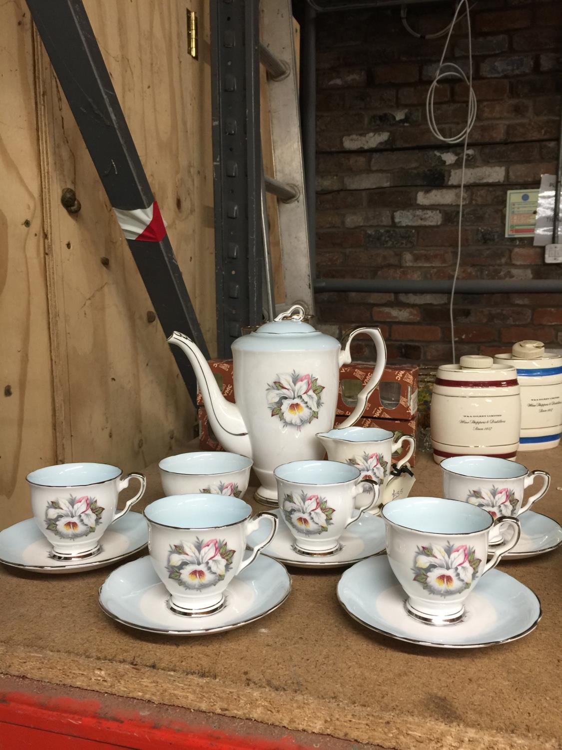 A ROYAL STAFFORD 'WHITE LADY' COFFEE SET TO INCLUDE COFFEE POT, CREAM JUG, SUGAR BOWL AND FIVE