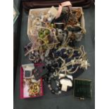 A QUANTITY OF COSTUME JEWELLERY TO INCLUDE BEADS, NECKLACES, BANGLES, PIN BADGEGS, EARRINGS, ETC