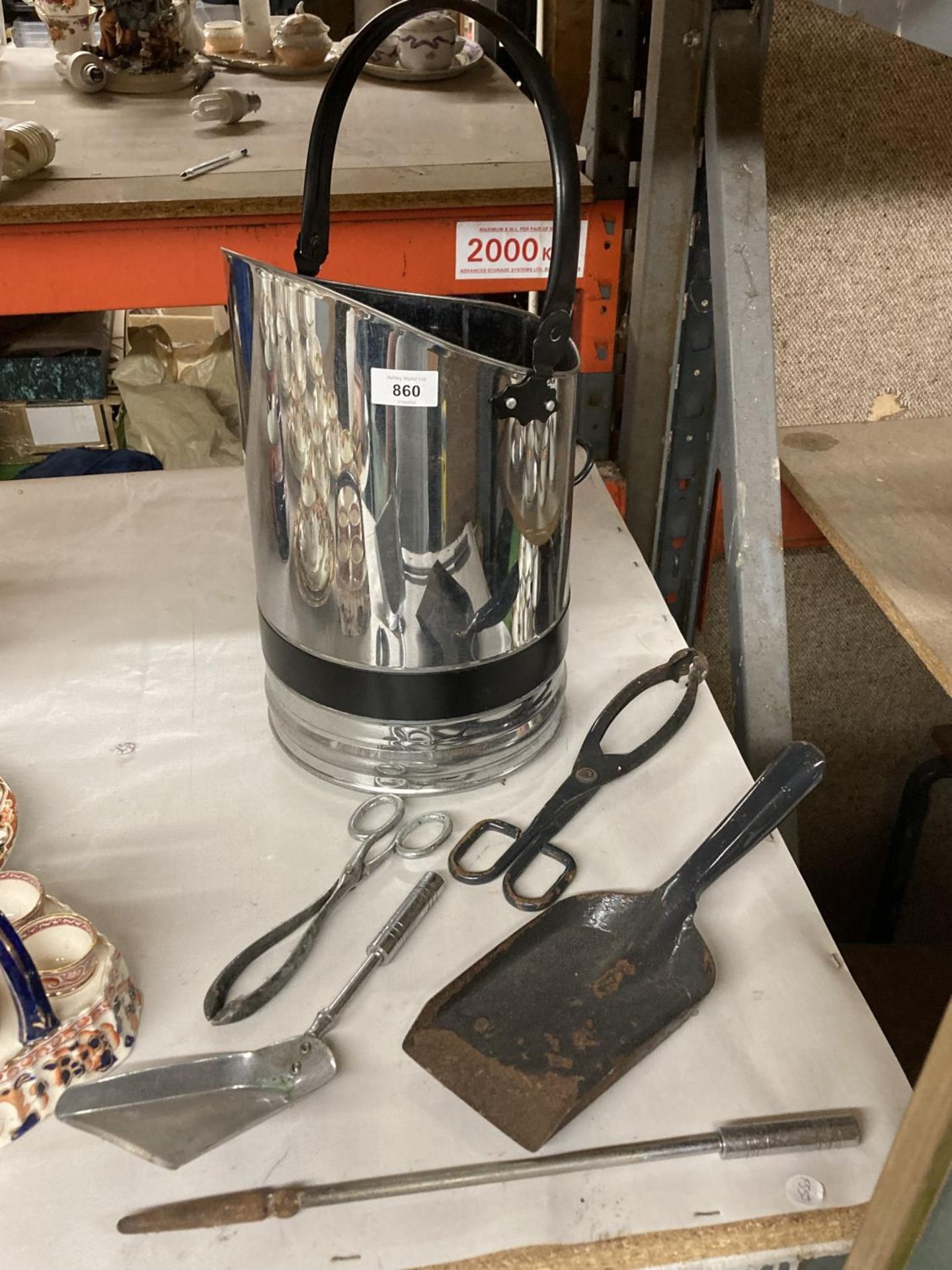 A STAINLESS STEEL AND BLACK COAL SCUTTLE, POKER, TONGS, SHOVEL, ETC