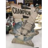 A VINTAGE CARDBOARD 'CHAMPION SPARKPLUGS' ADVERTISING SIGN