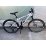 A GT AVALANCHE ALL TERRA MOUNTAIN BIKE WITH FRONT AND REAR SUSPENSION AND 24 SPEED GEAR SYSTEM