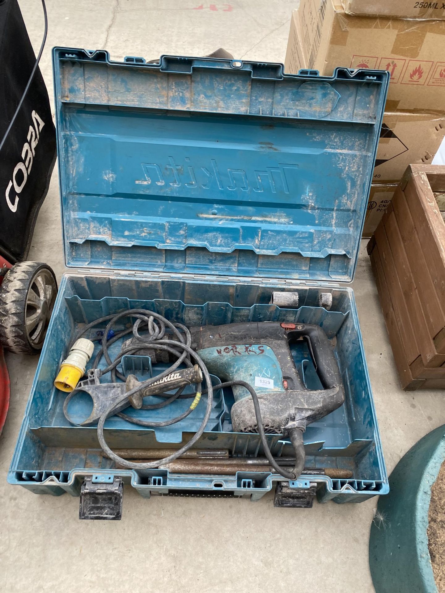 A MAKITA 110V BREAKER AND A SELECTION OF CHISELS